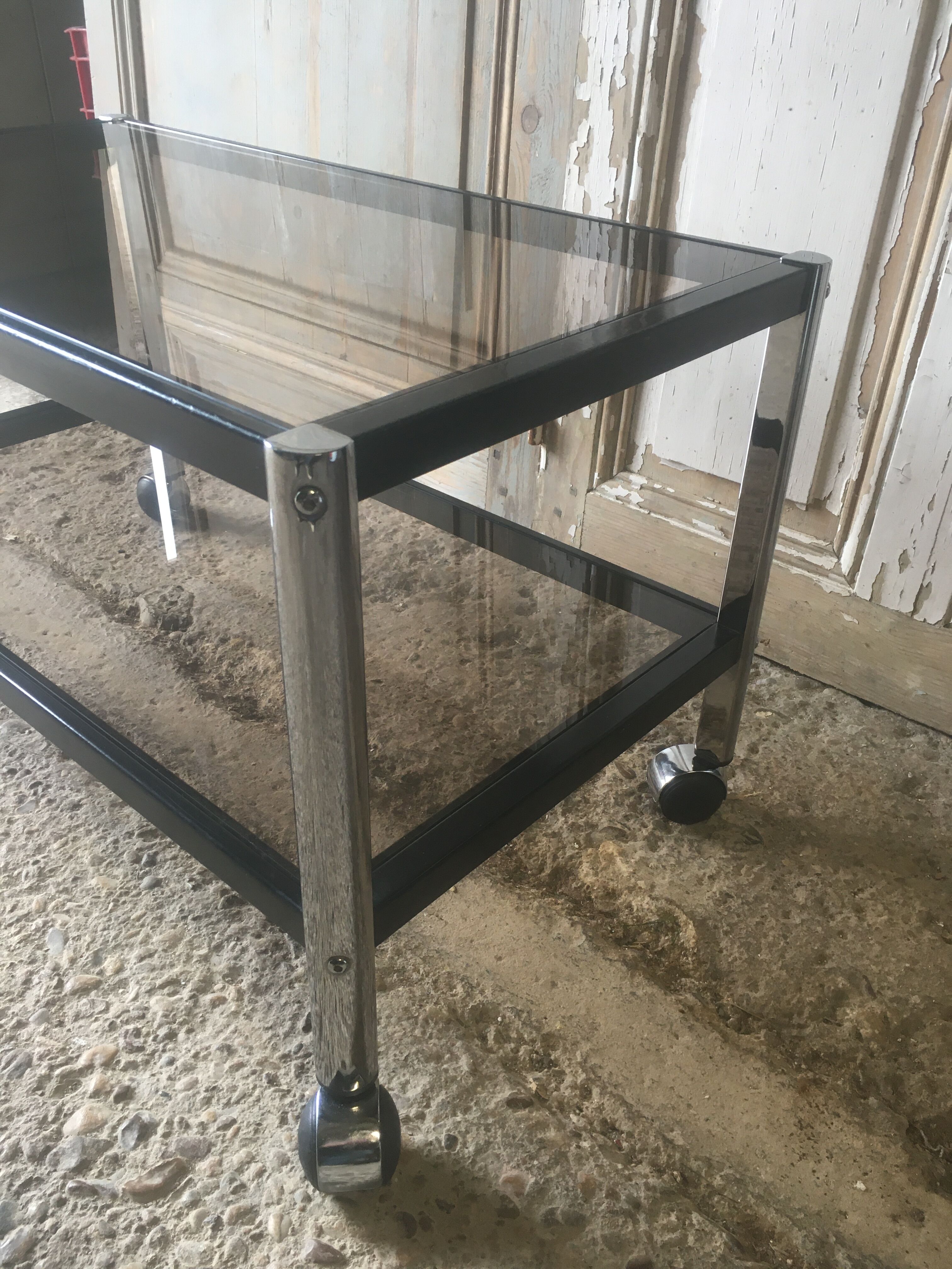 Metal coffee table with smoked glass.