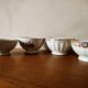 Set of 12 mismatched porcelain bowls