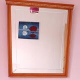 Beveled glass wall mirror in solid wood frame