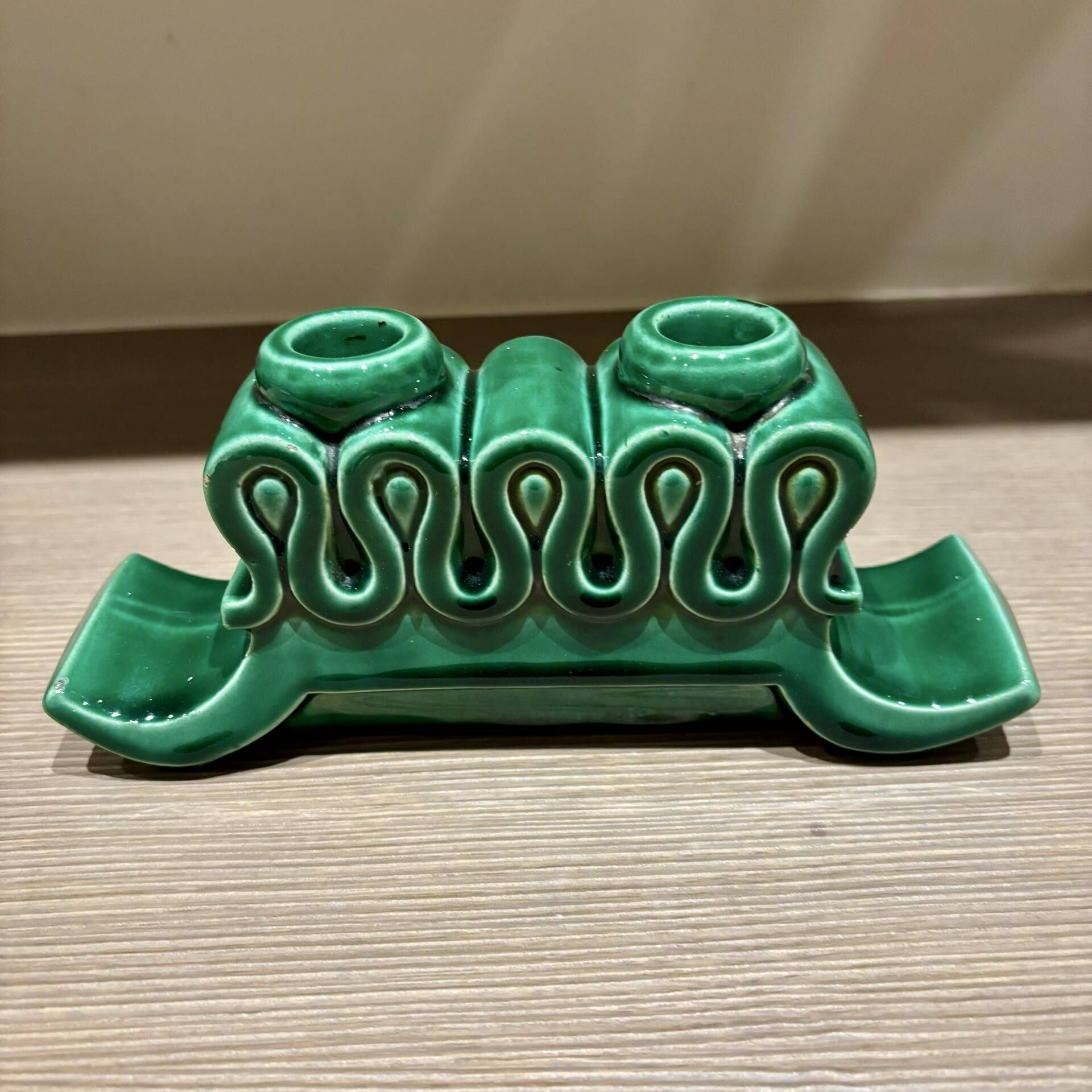 Pair of Art Deco green ceramic candlesticks