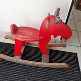 Old reindeer with wooden rocking