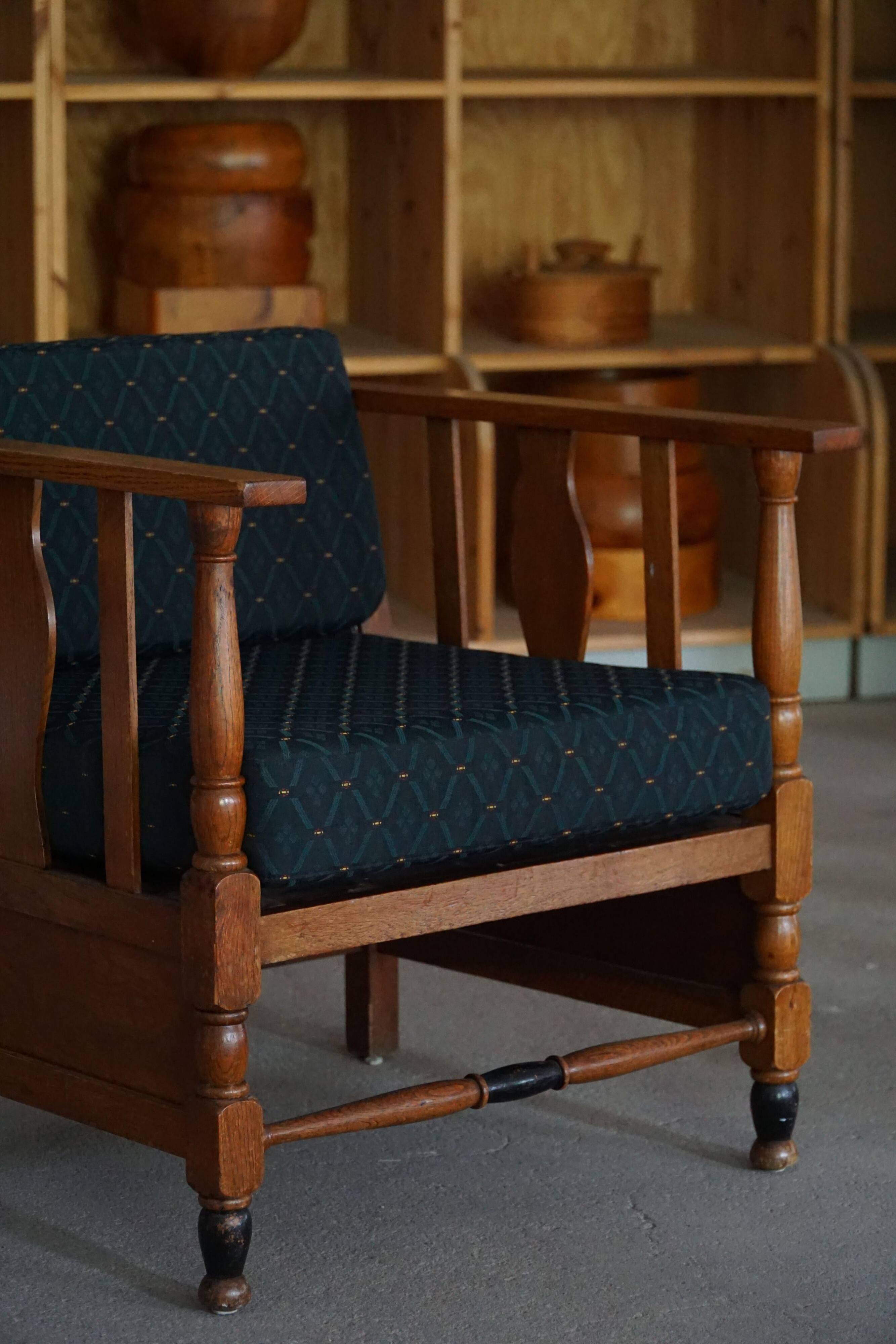Art Nouveau, pair of oak lounge chairs, reupholstered in style fabric, 1920s.