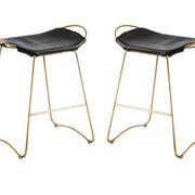 Pair of backless stools, black with brass trim.