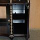 Contemporary Chinese buffet with a marble top and space for a mini-fridge.