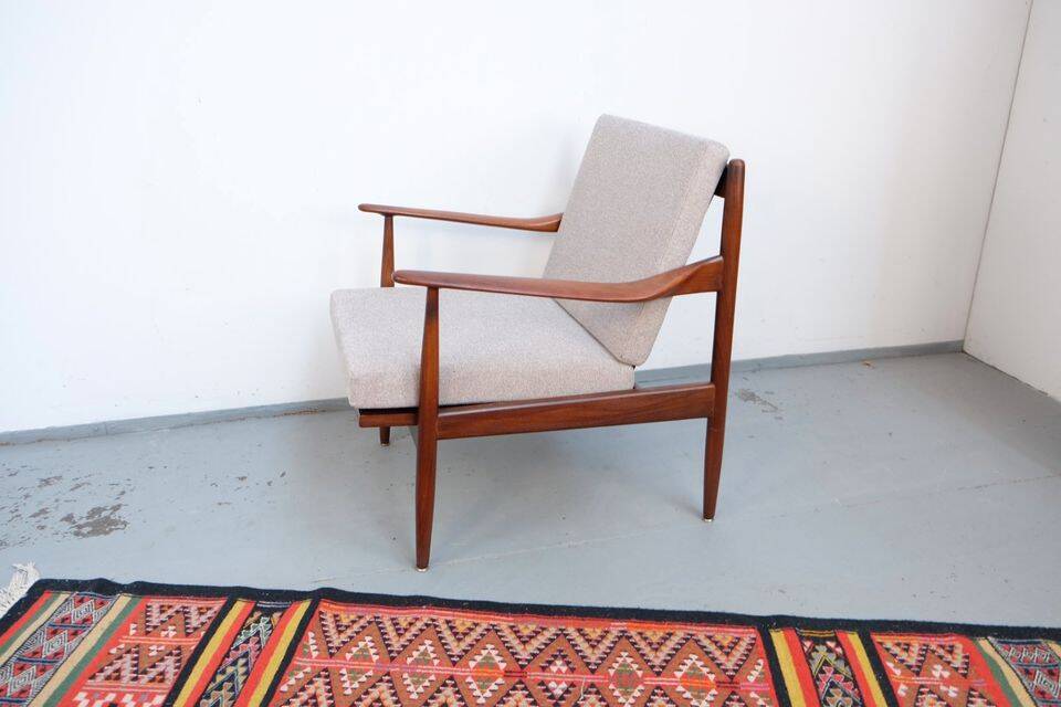 Vintage teak lounge chair, retro 1960s–70s style.