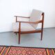 Vintage teak lounge chair, retro 1960s–70s style.