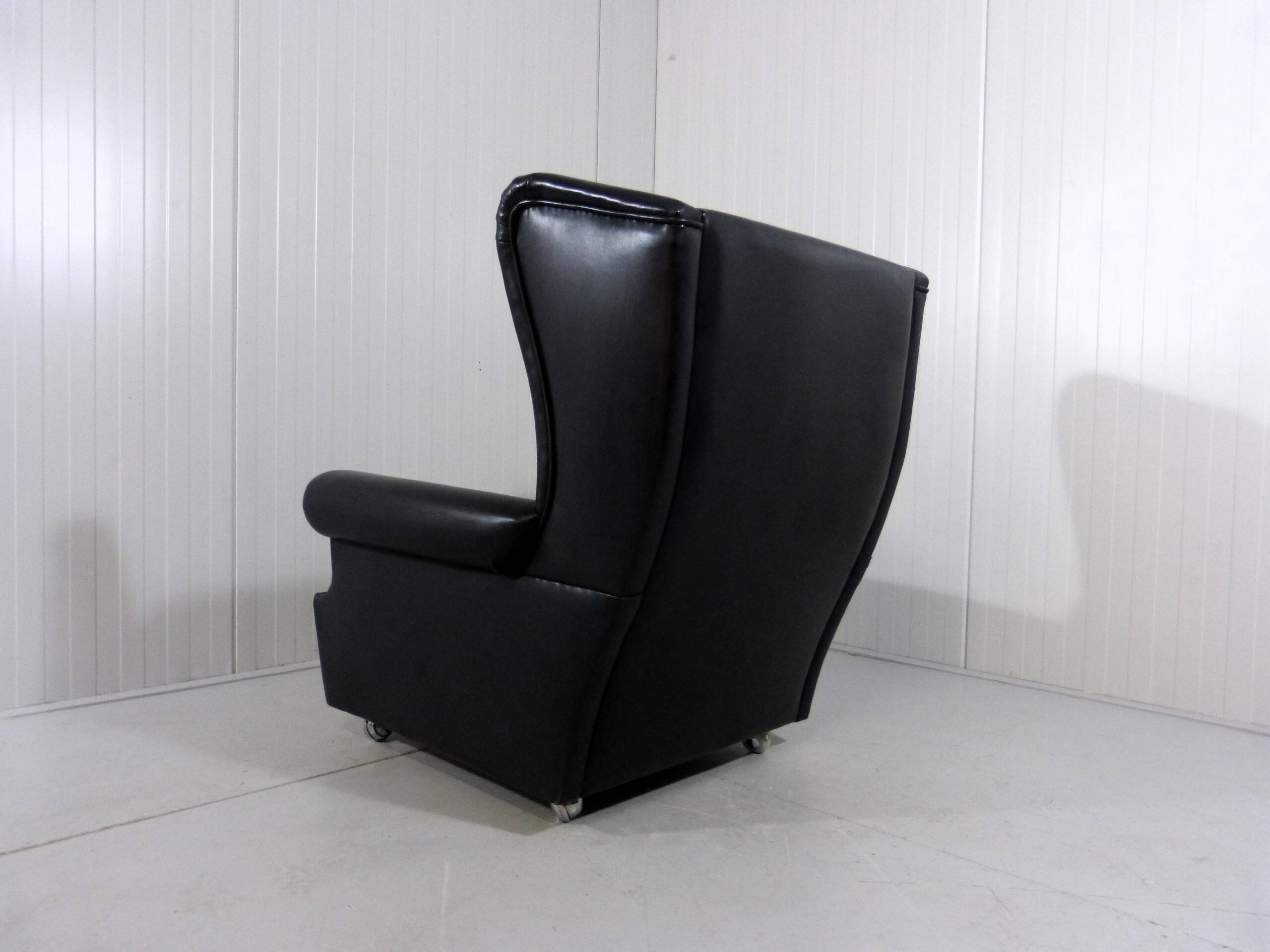 Black leather wingback chair on wheels 1960’s
