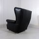 Fauteuil à oreilles en cuir noir sur roulettes années 1960