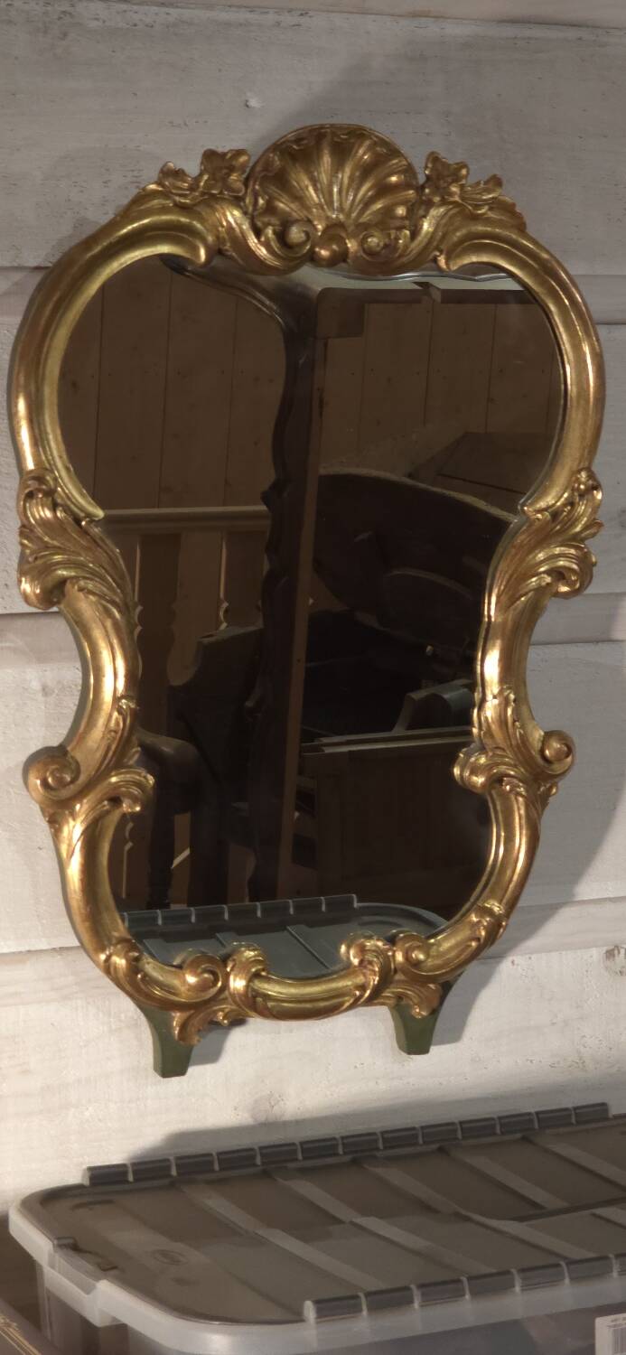 Golden wood mirror.