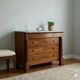 Antique Empire walnut and marble commode, 19th century.