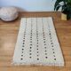 Berber rug with aligned black dots, 95x150 cm.