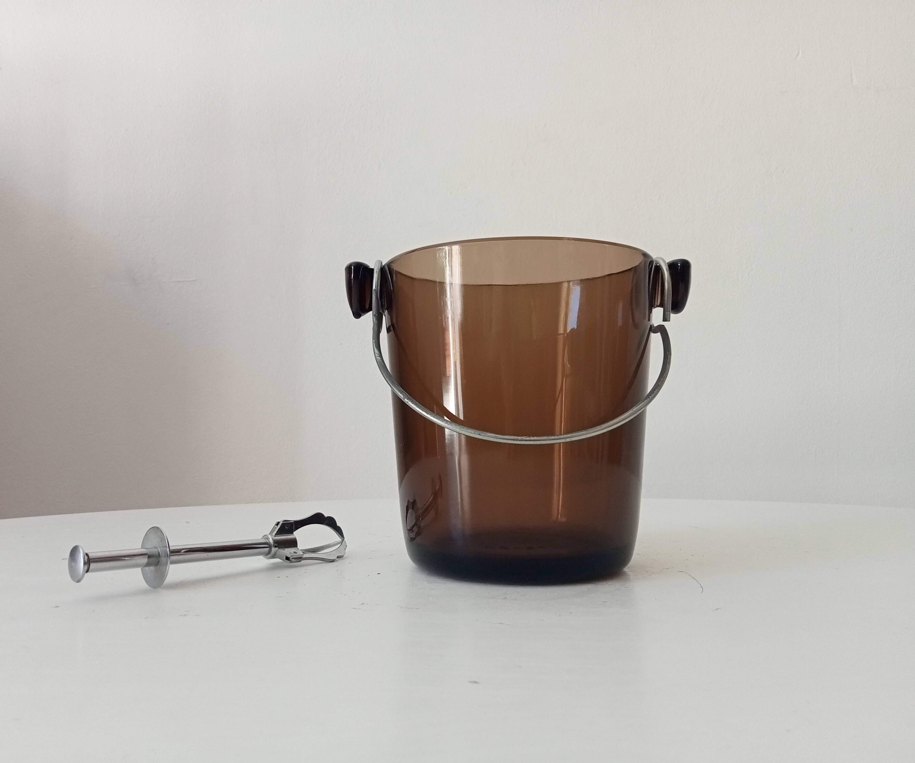 Vintage 1970s ice bucket and tongs.
