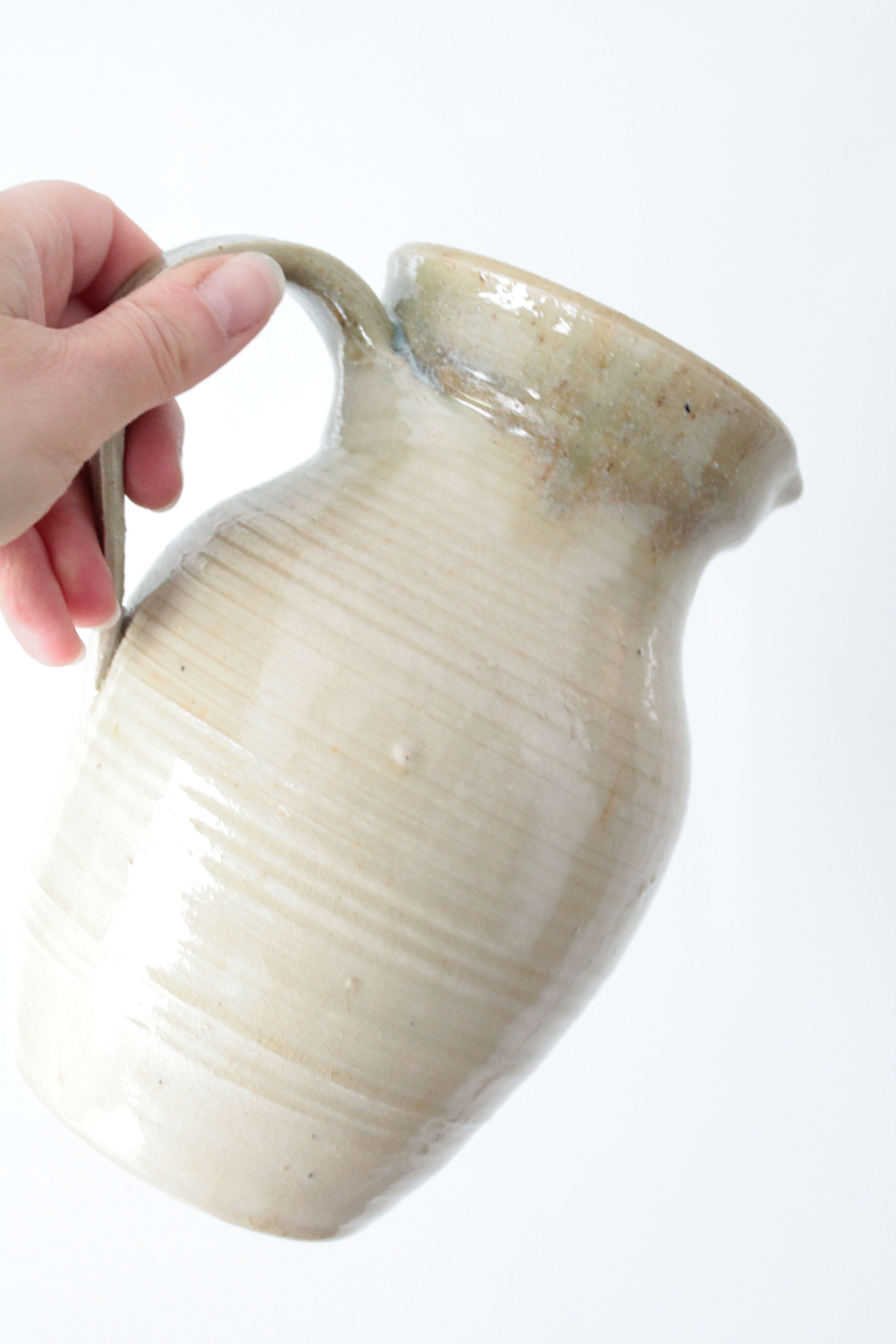 Old decanter in enamelled sandstone