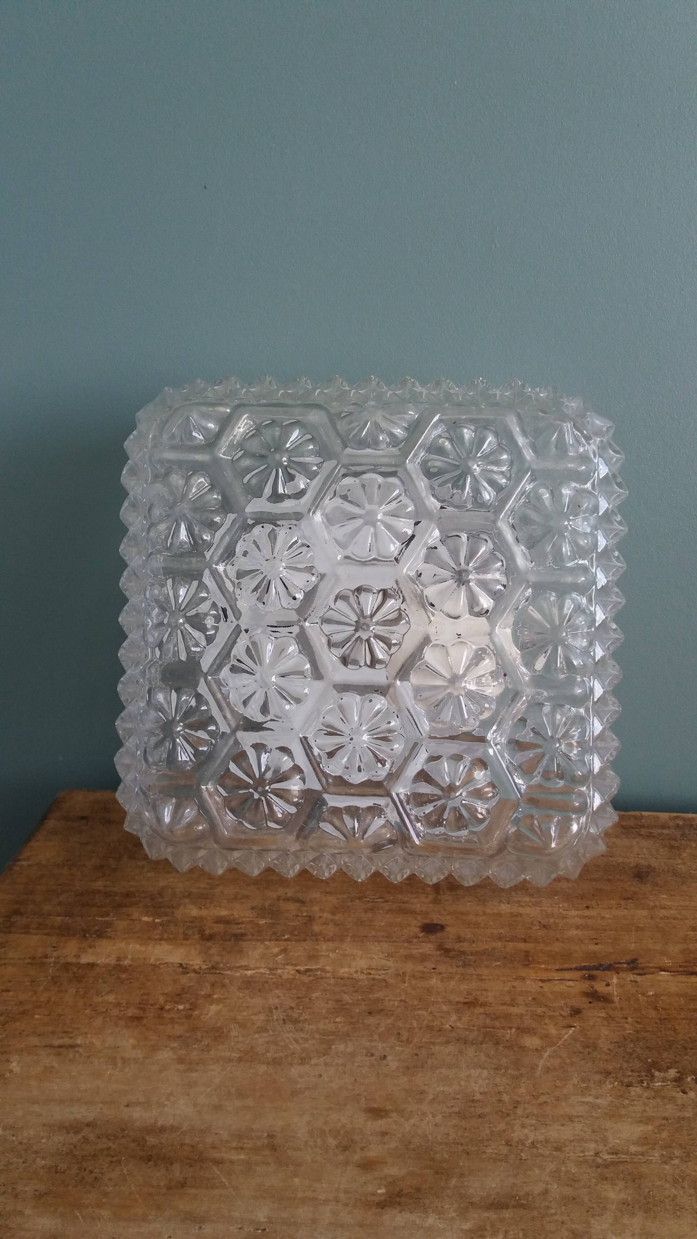 Square globe ceiling light in moulded glass.