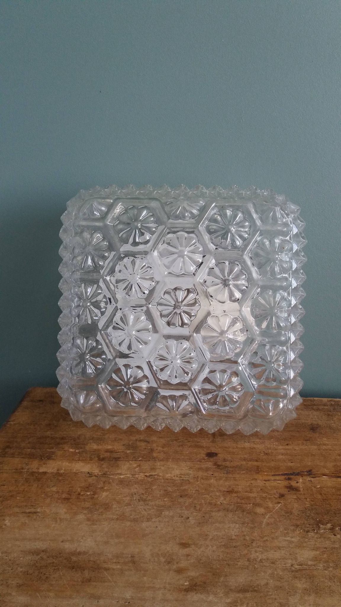 Square globe ceiling light in moulded glass.