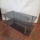 Smoked glass and brass coffee table from the 1970s.