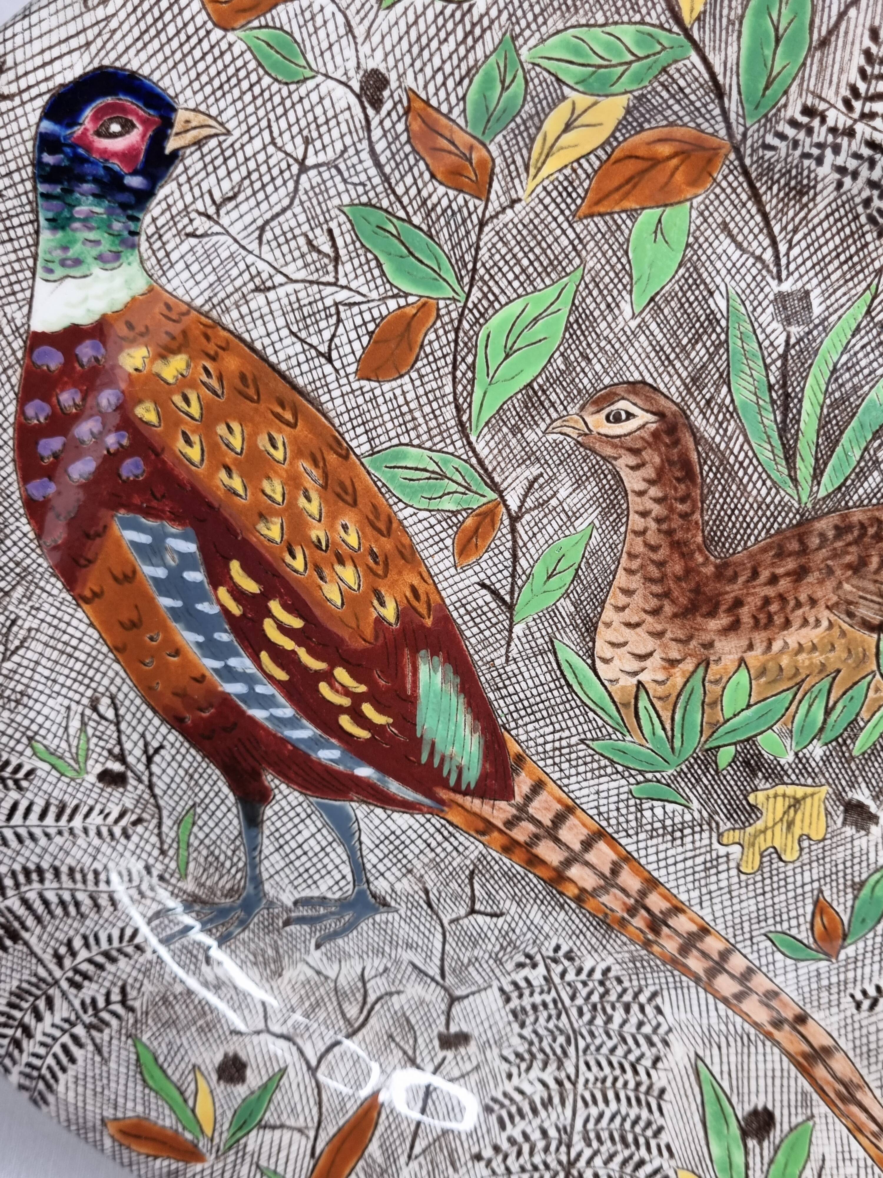 Plate in gien earthenware model rambouillet "couple of pheasants" signed in the décor, 26 cm