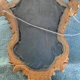 Antique scalloped mirror with pediment decorated with cherubs – carved gilded wood