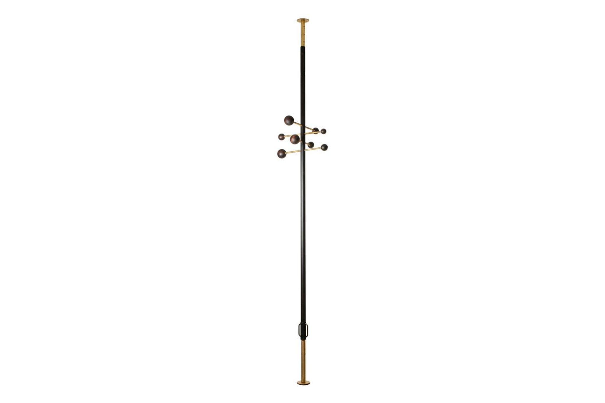 Coat rack from floor to ceiling in lacquered metal and brass. Contemporary.