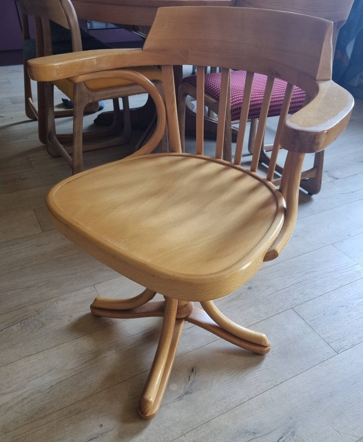 Wooden swivel armchair