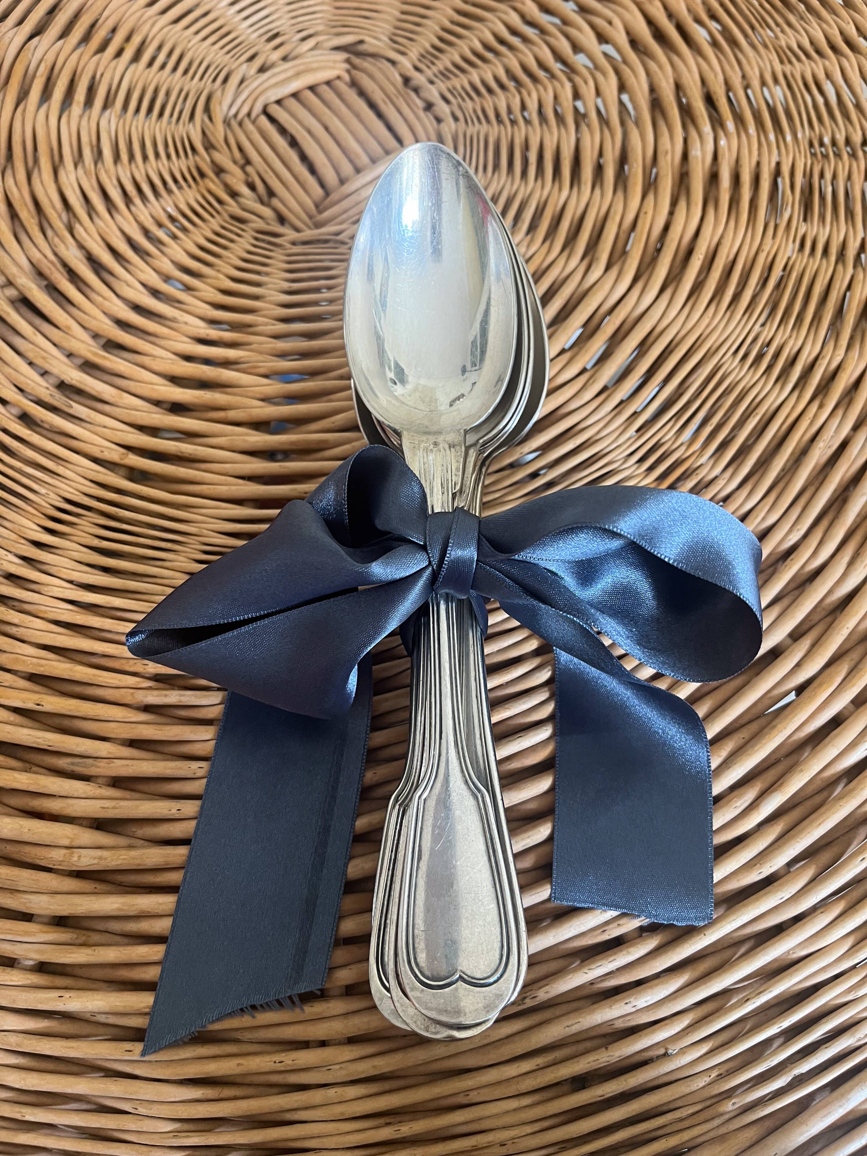 Set of 8 silver metal spoons