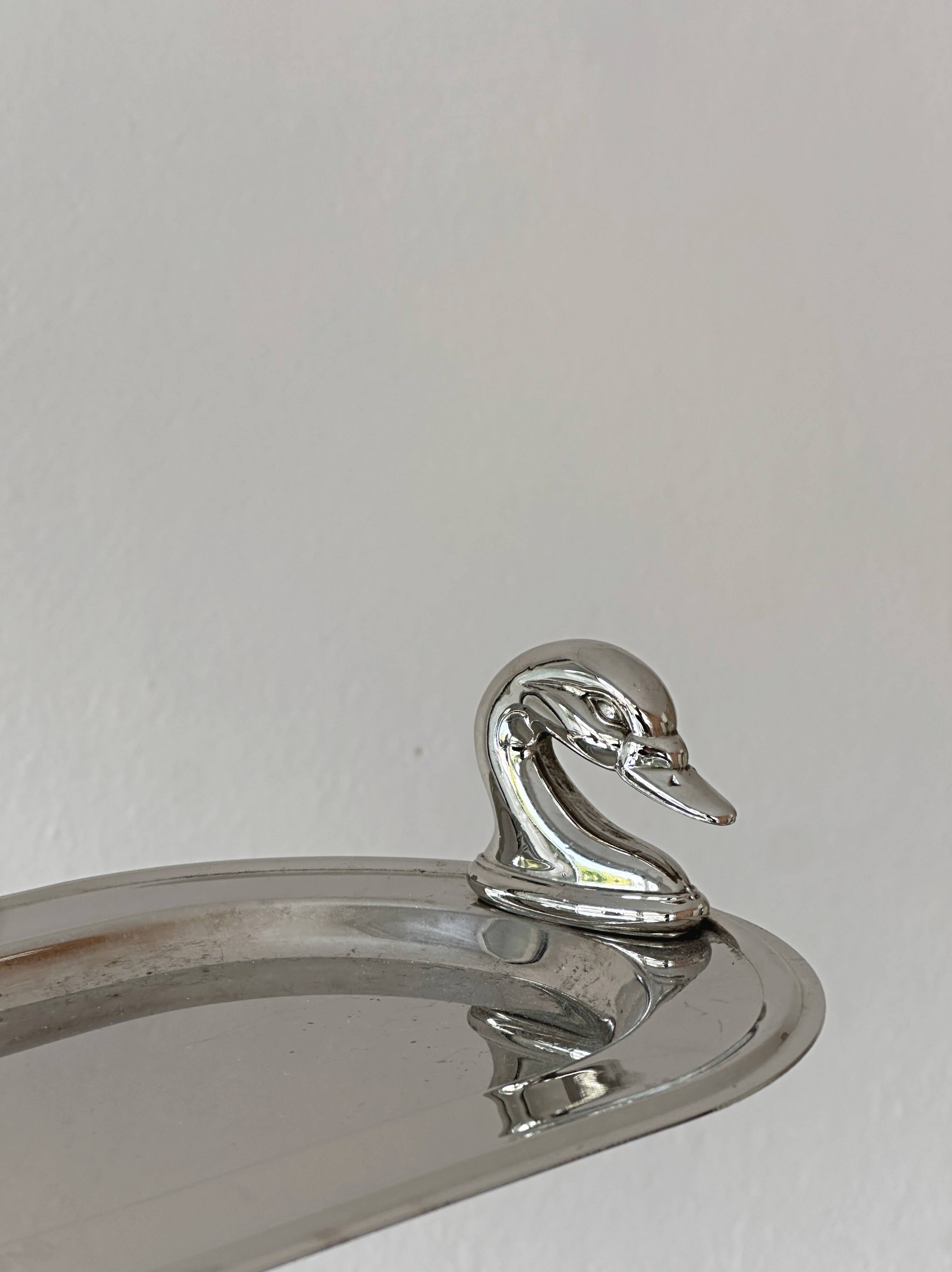 Metal dish with goose head handles serving tray
