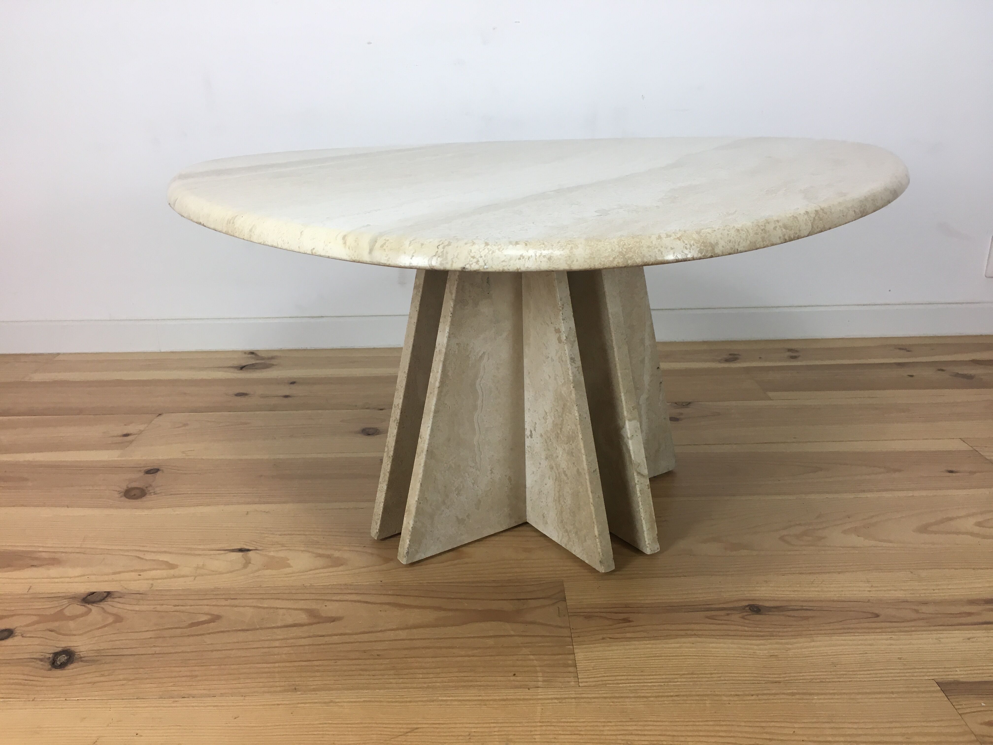 Travertine coffee table goes up and down to jack