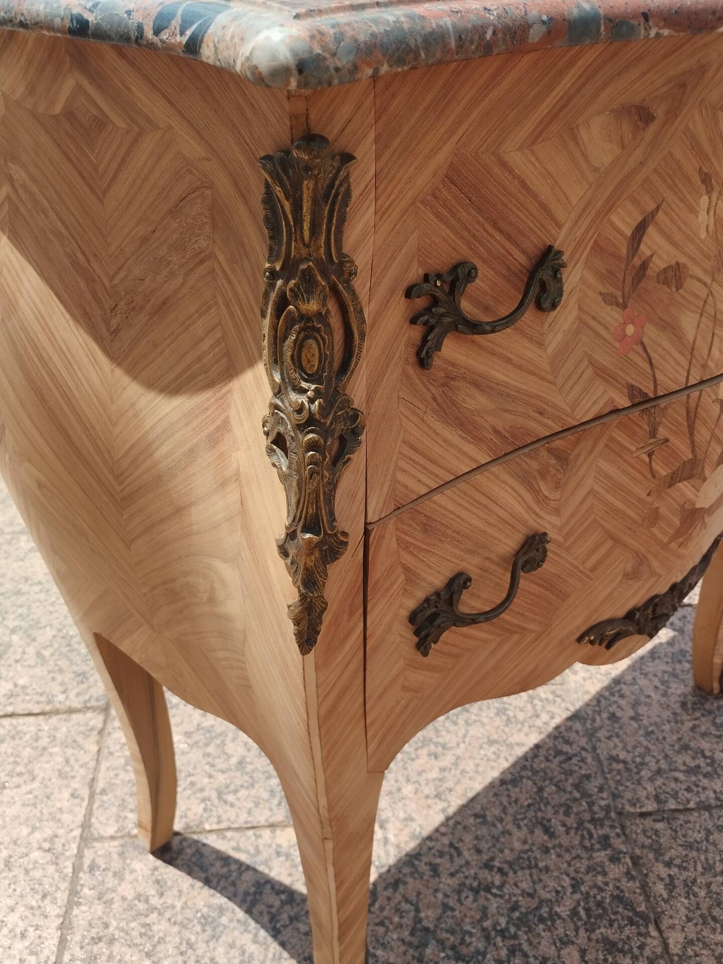 Antique commode in marquetry in the Louis XV style with a marble top.