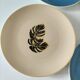 Set of 7 porcelain plates, gold foliage & jungle