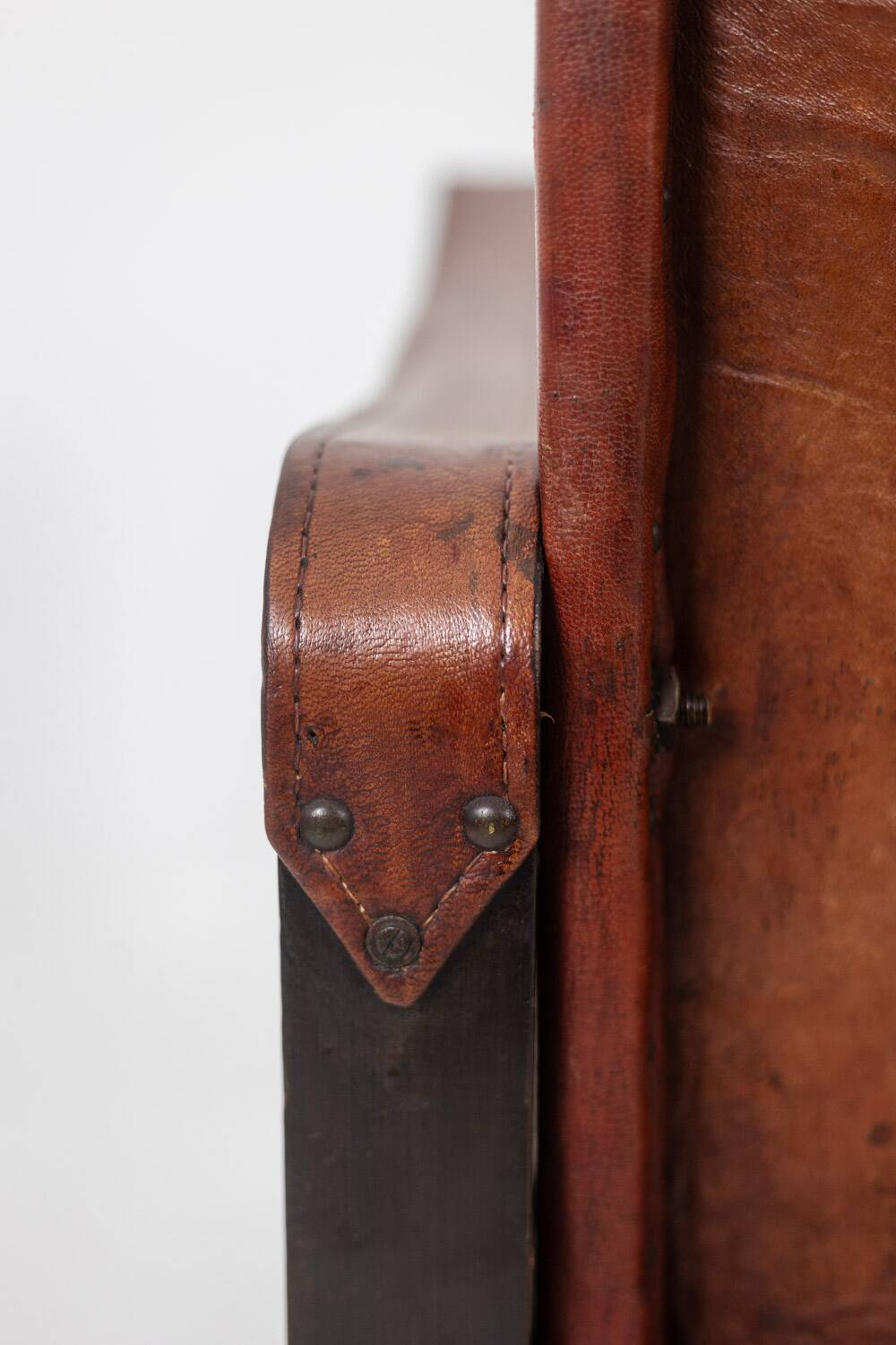 “Safari” armchair in wood and cognac leather. 1960s/70s.