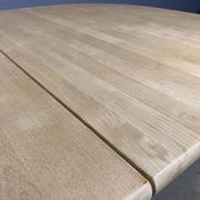 Oval extendable dining table in beech with Danish design.
