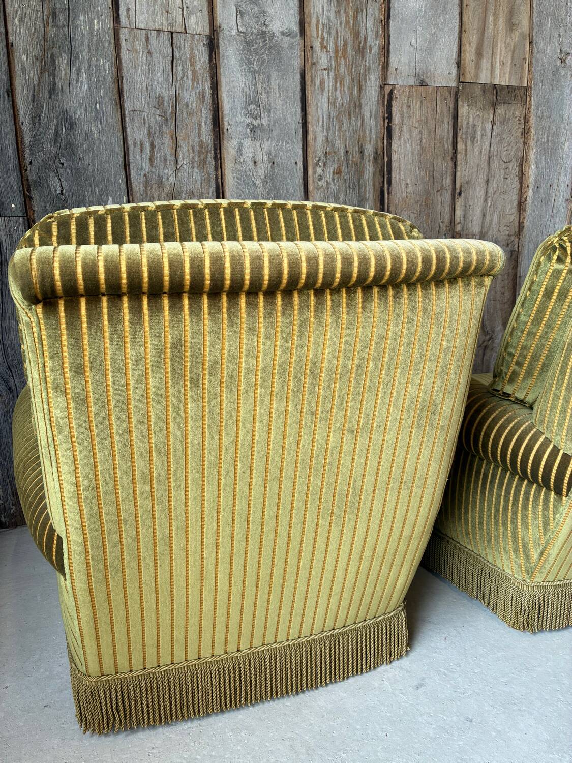 Pair of green recliner chairs