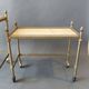 Neoclassical nesting trolleys in gilded brass and peach marble 1950/1960.