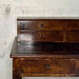 Wooden lady's desk says "happiness of the day"