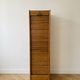 Antique oak filing cabinet with curtains