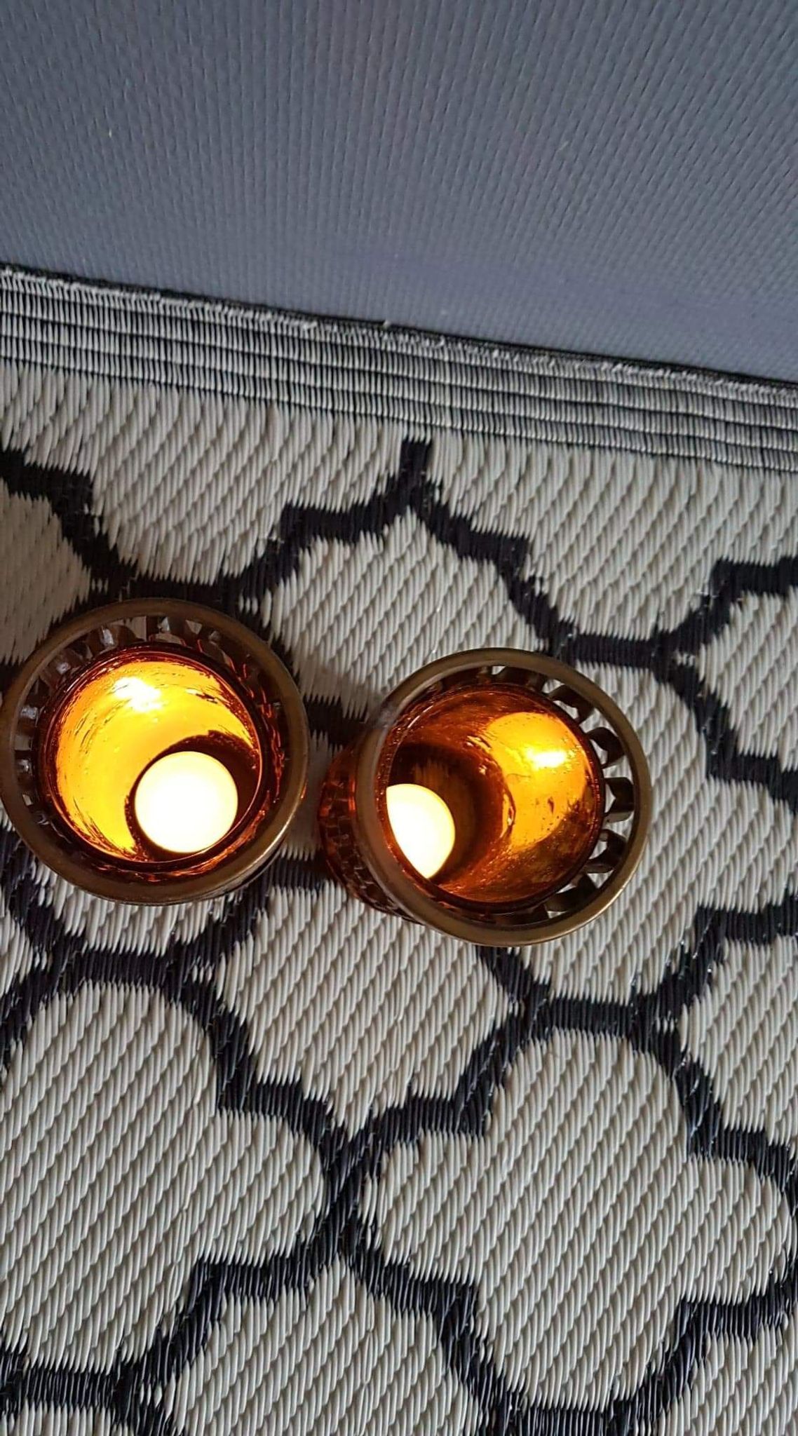 Photophores moucharabieh style candlesticks in brass and orange bubbled glass