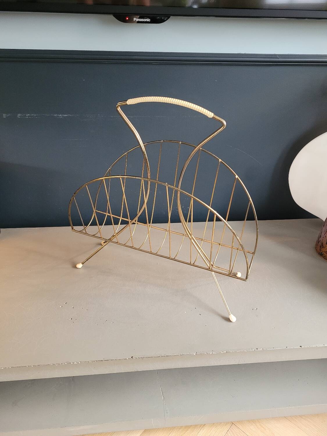 Vintage gold metal magazine rack