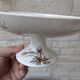 Flat serving compote dish in Terre de Fer HB & Cie with brown floral decoration.