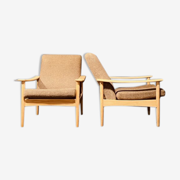 Mid-century pair of elm armchairs by Guy Rogers