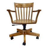 Solid wood swivel and reclining armchair.