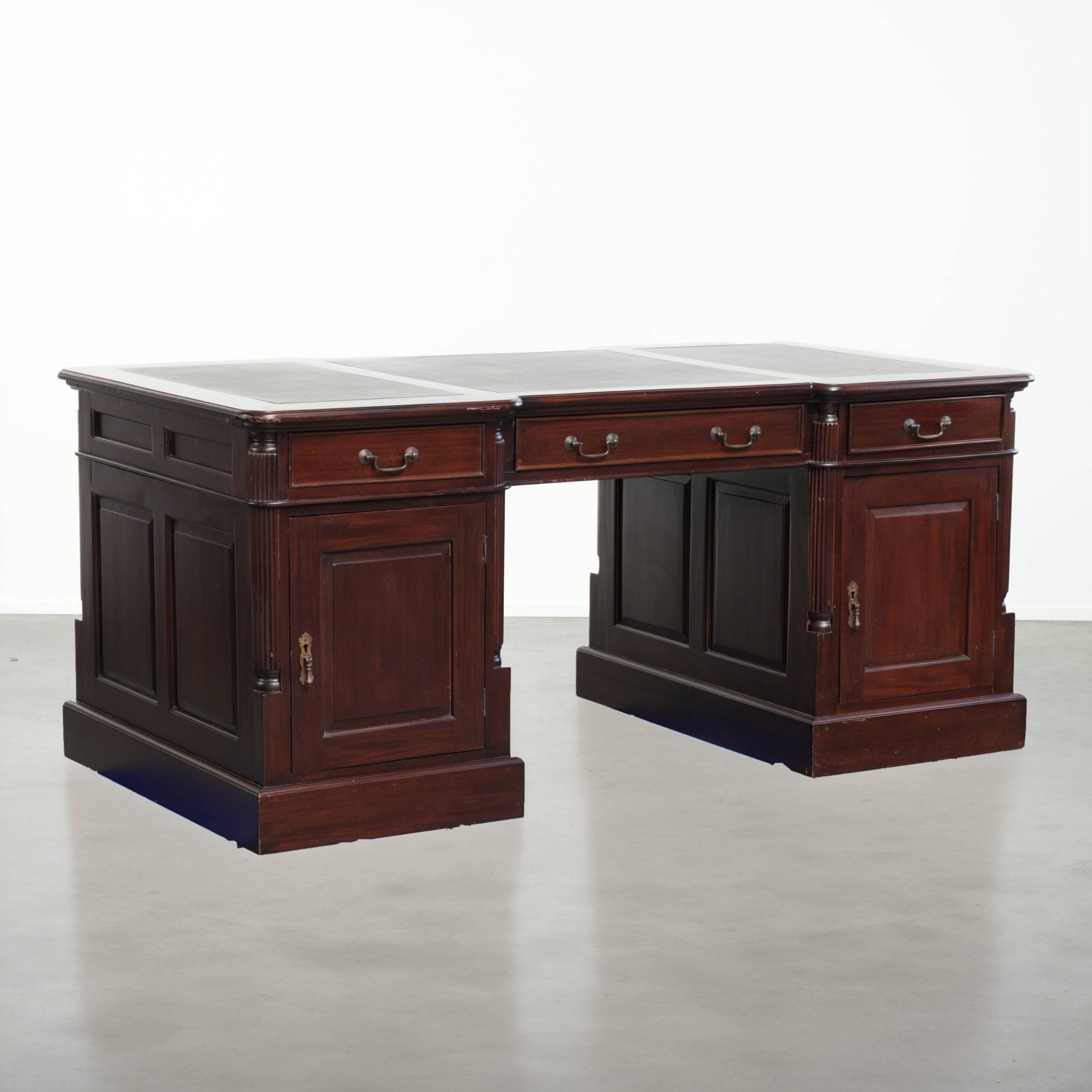Partner desk in English style with dark wood and a green leather top