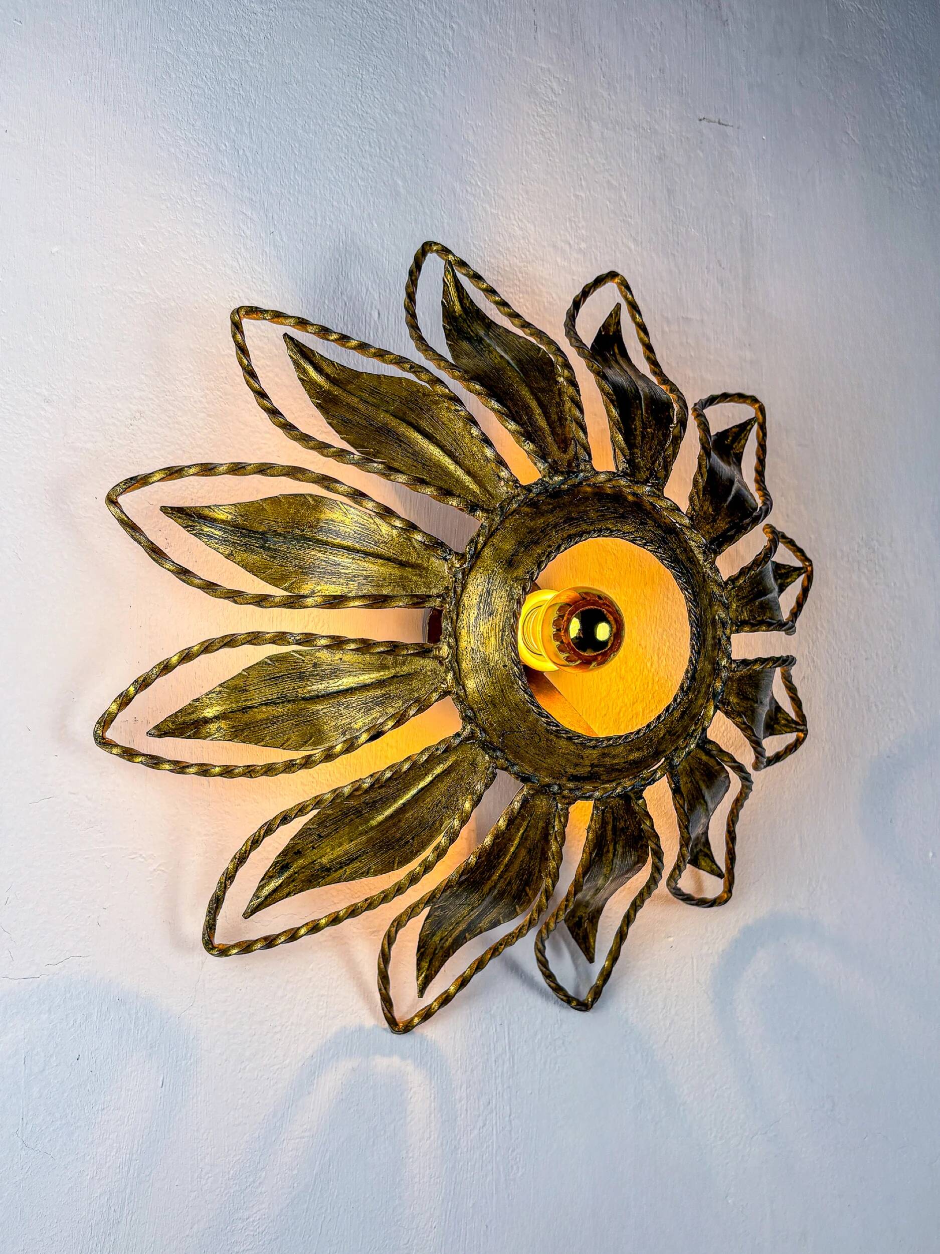 Sunburst ceiling light fixture or sconce, gilt iron & exposed bulb France, 1970s
