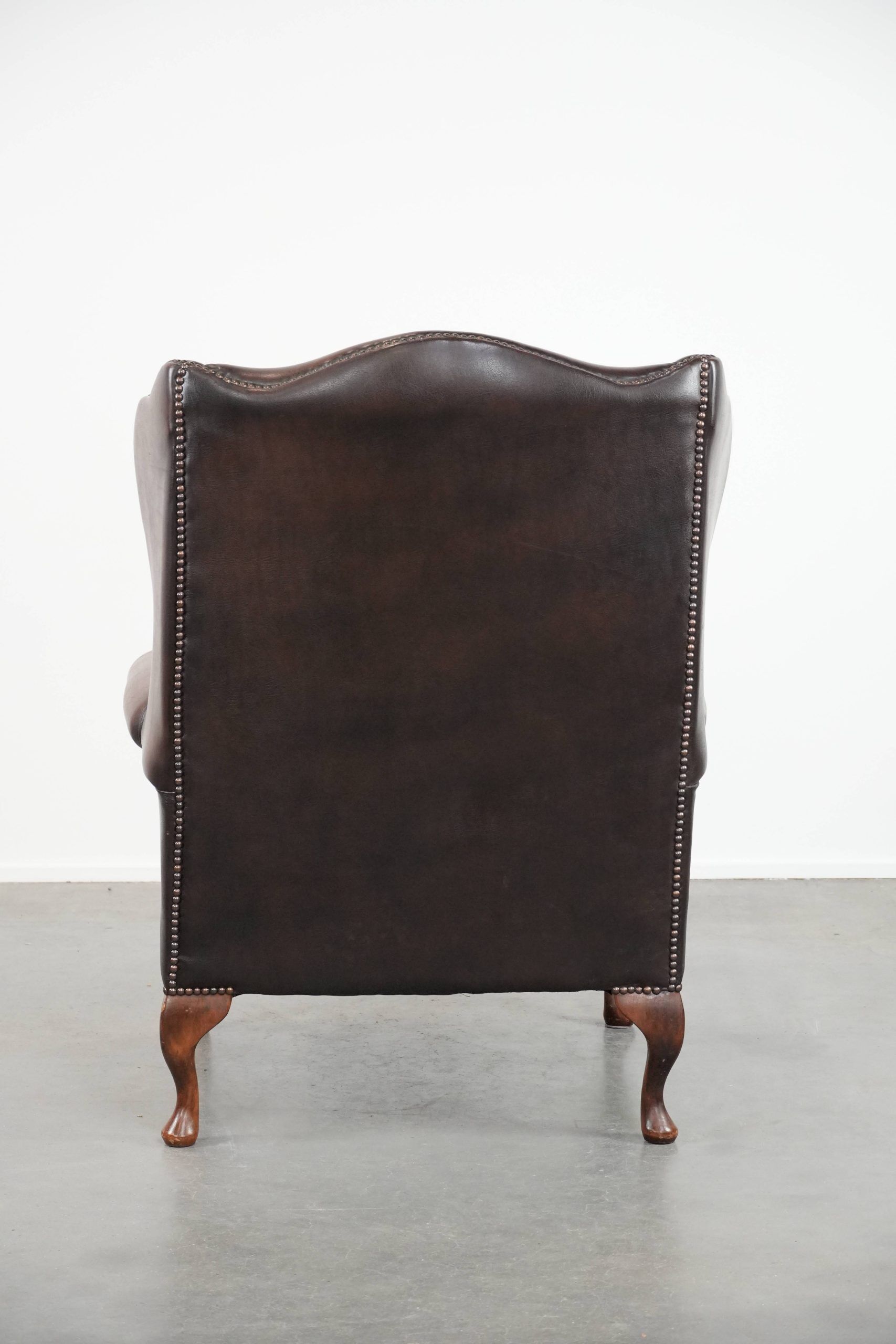 Brown smooth cow leather Chesterfield wingback armchair in English style