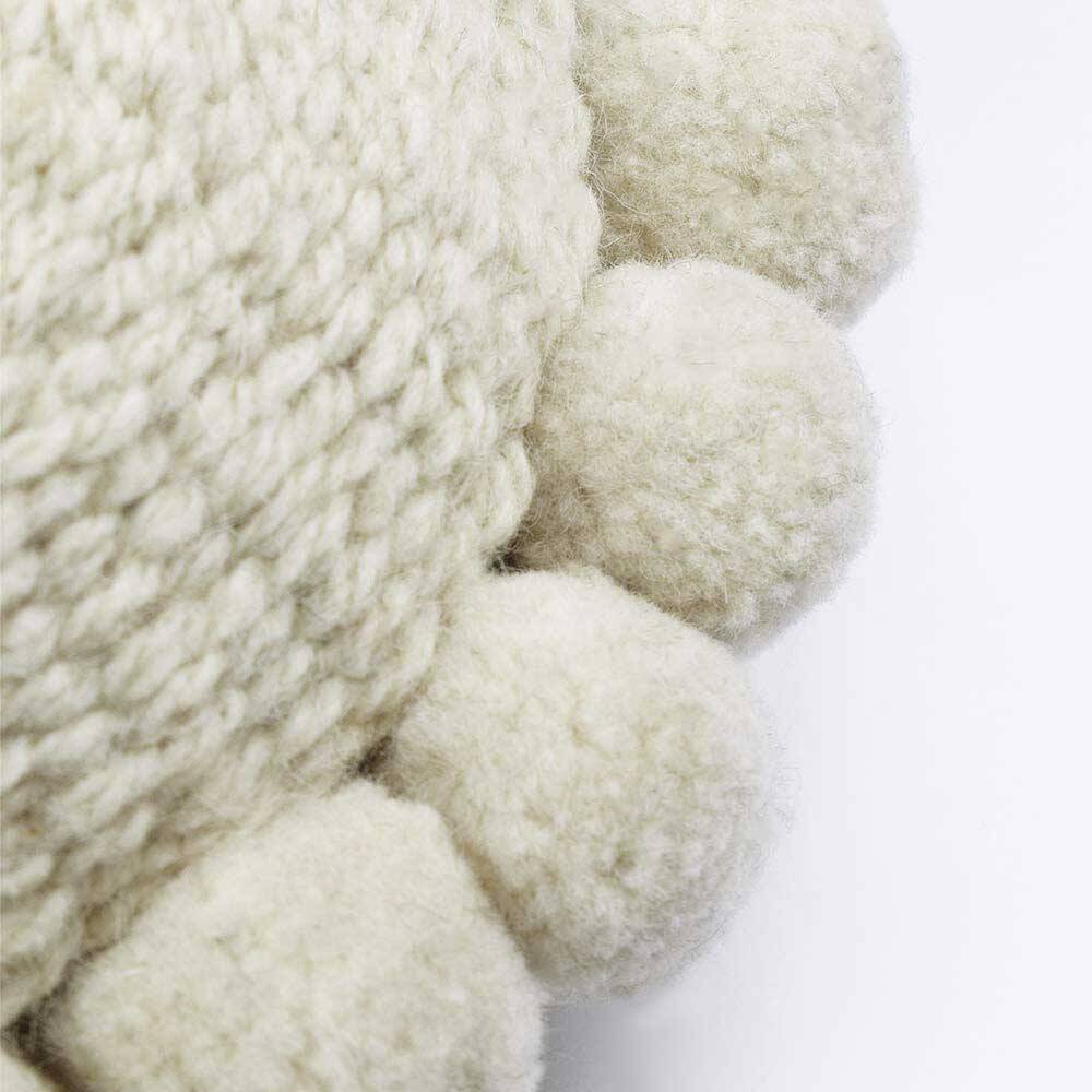 Mini coussin rond à pompons blanc en laine