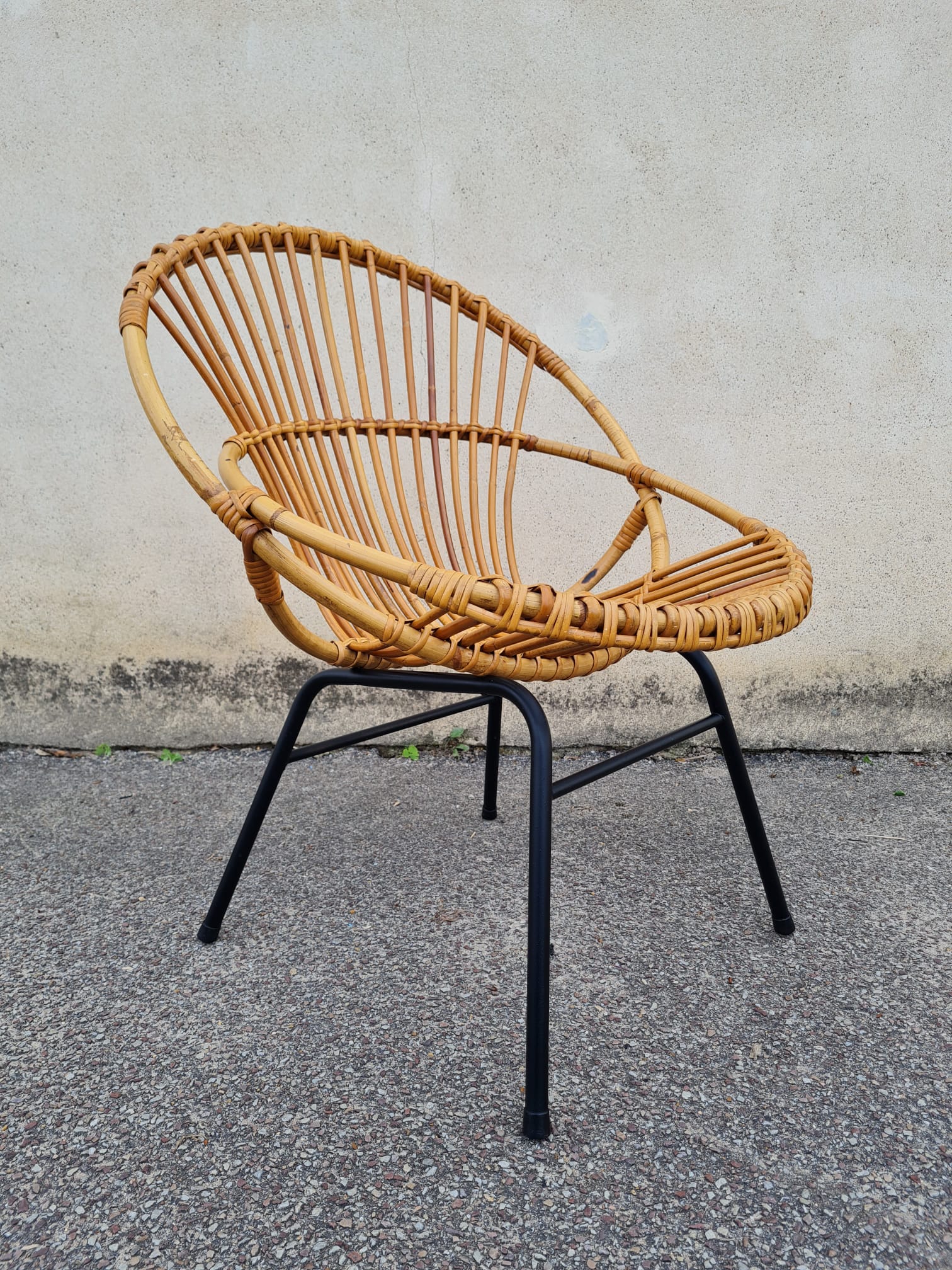 Vintage rattan shell armchair from the 60s