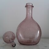 A bolted glass carafe