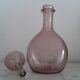 A bolted glass carafe