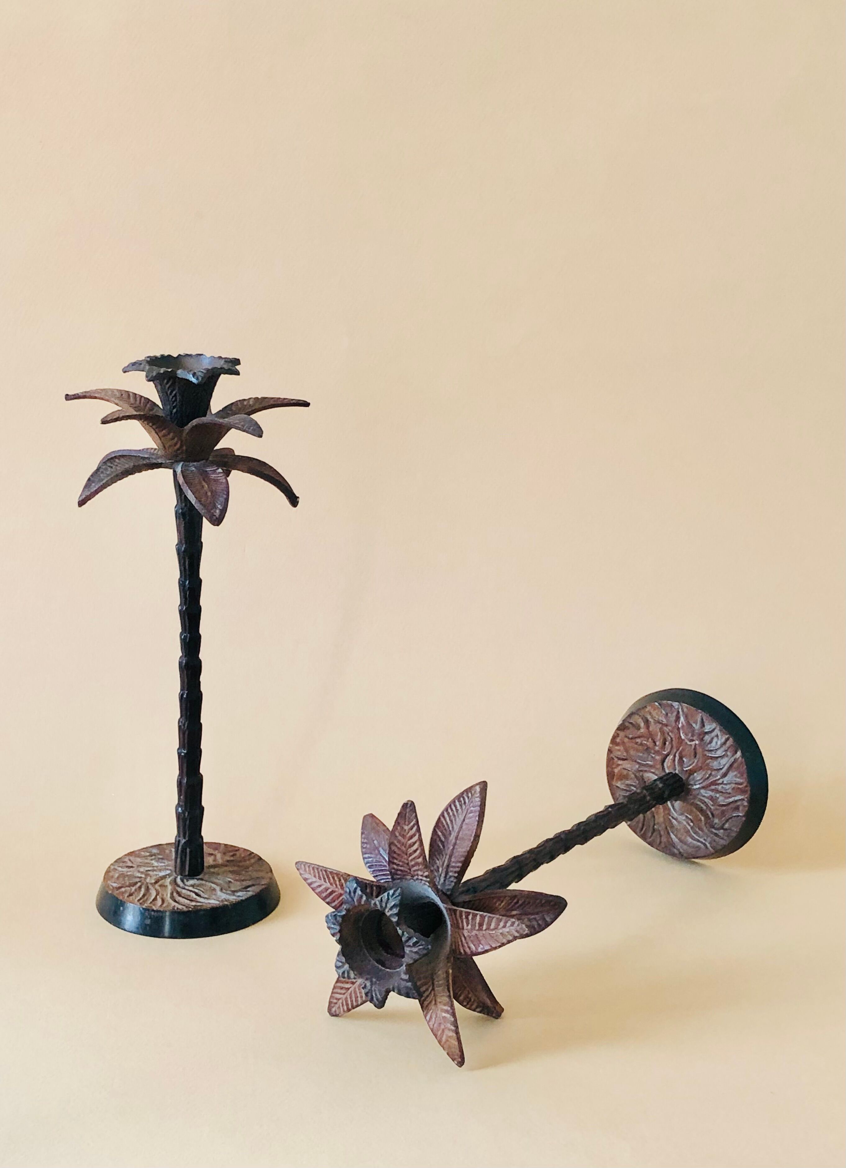 Pair of patinated metal candlesticks