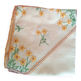 Hand-embroidered yellow square tablecloth.