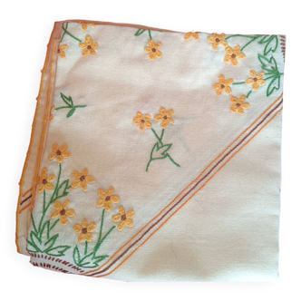 Hand-embroidered yellow square tablecloth.